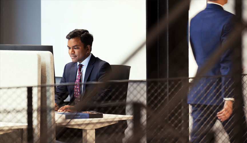 Man in suit working at an office desk